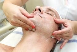 man getting a facial